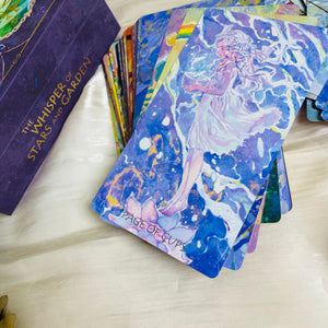 The Whisper of Stars and Garden Tarot card artwork and packaging